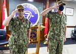 210211-N-UA460-0084 SINGAPORE (Feb. 11, 2021) – Capt. Tom Ogden relieves Capt. Ann McCann as commodore of Destroyer Squadron Seven (DESRON 7), during the DESRON 7 change of command ceremony in Singapore. As the U.S. Navy’s destroyer squadron forward-deployed in Southeast Asia, DESRON 7 serves as the primary tactical and operational commander of littoral combat ships rotationally deployed to Singapore, and builds partnerships through training exercises and military-to-military engagements. (U.S. Navy photo by Mass Communication Specialist 1st Class Greg Johnson)