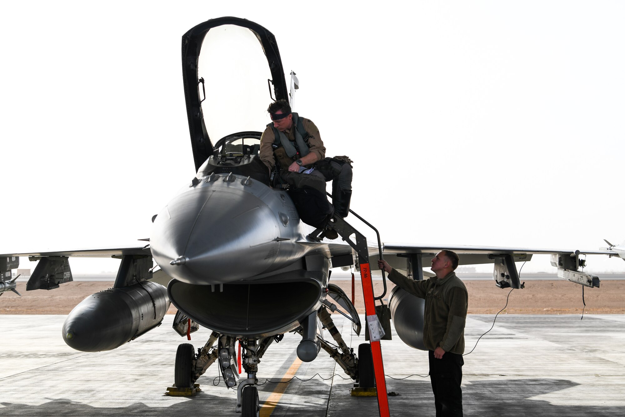 Airman 1st Class Renfro, 77th Fighter Generation Squadron crew chief, performs a pre-flight inspection on an F-16C Fighting Falcon Feb. 2, 2021, at King Faisal Air Base, Kingdom of Saudi Arabia.