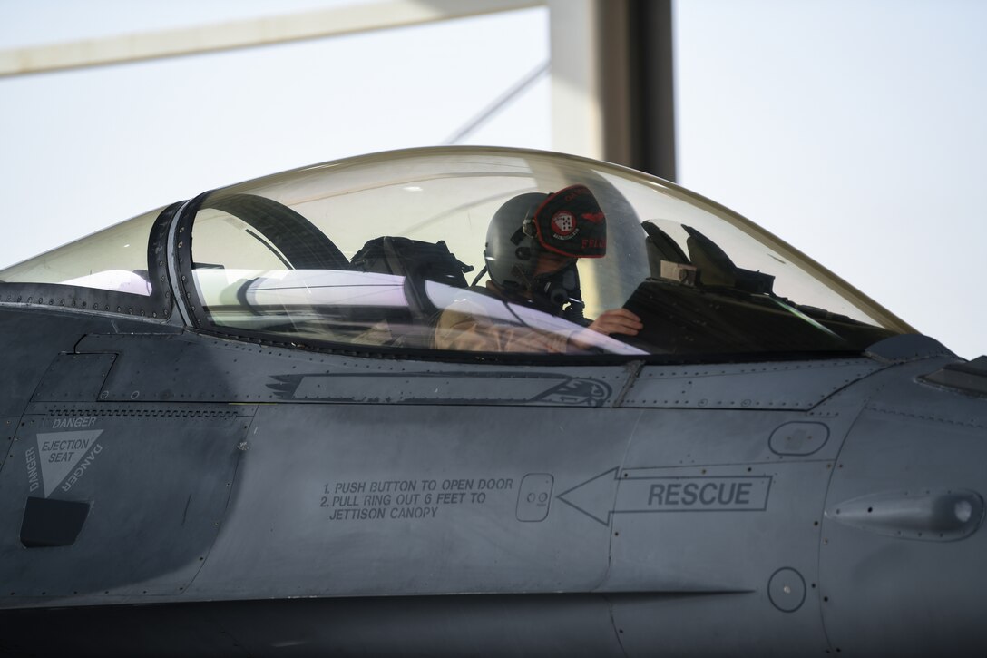 A pilot with the 77th Expeditionary Fighter Squadron, prepares for a sortie in a F-16C Fighting Falcon Feb. 2, 2021, at King Faisal Air Base, Kingdom of Saudi Arabia.