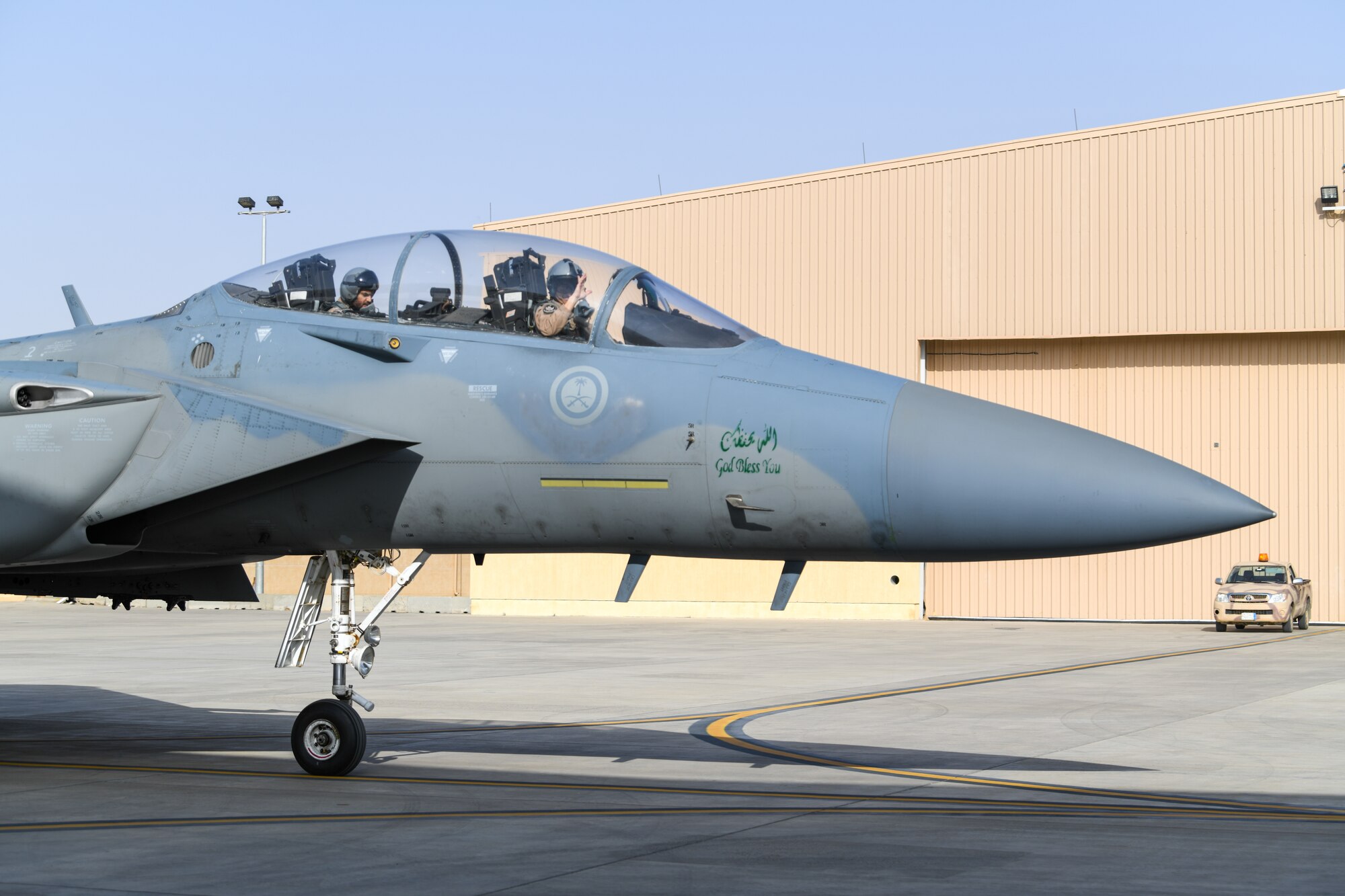 A Royal Saudi Air Force F-15 Eagle pilot waves while taxiing for take-off, Feb. 2, 2021, at King Faisal Air Base, Kingdom of Saudi Arabia.