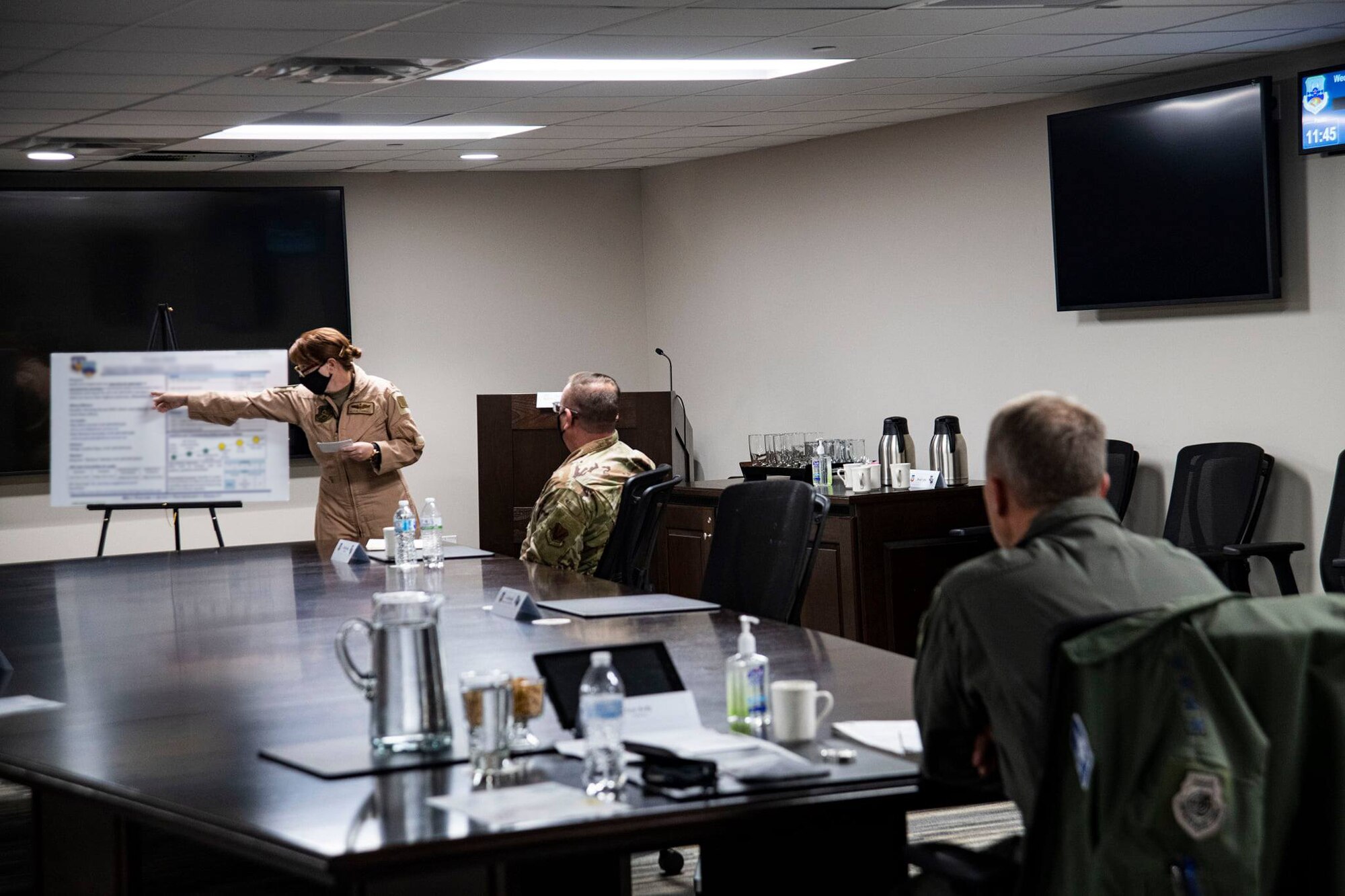 U.S. Air Force Maj. Alicia Carroll, 9th Air Force (AFCENT)/A5M Integrated Air and Missile Defense deputy division chief, briefs Gen. Mark Kelly, commander of Air Combat Command, and  Chief Mast Sgt. David Wade, command chief of ACC, on the 9 AF (AFCENT) Equality Working Group during their visit to Shaw Air Force Base, Nov. 6, 2020.