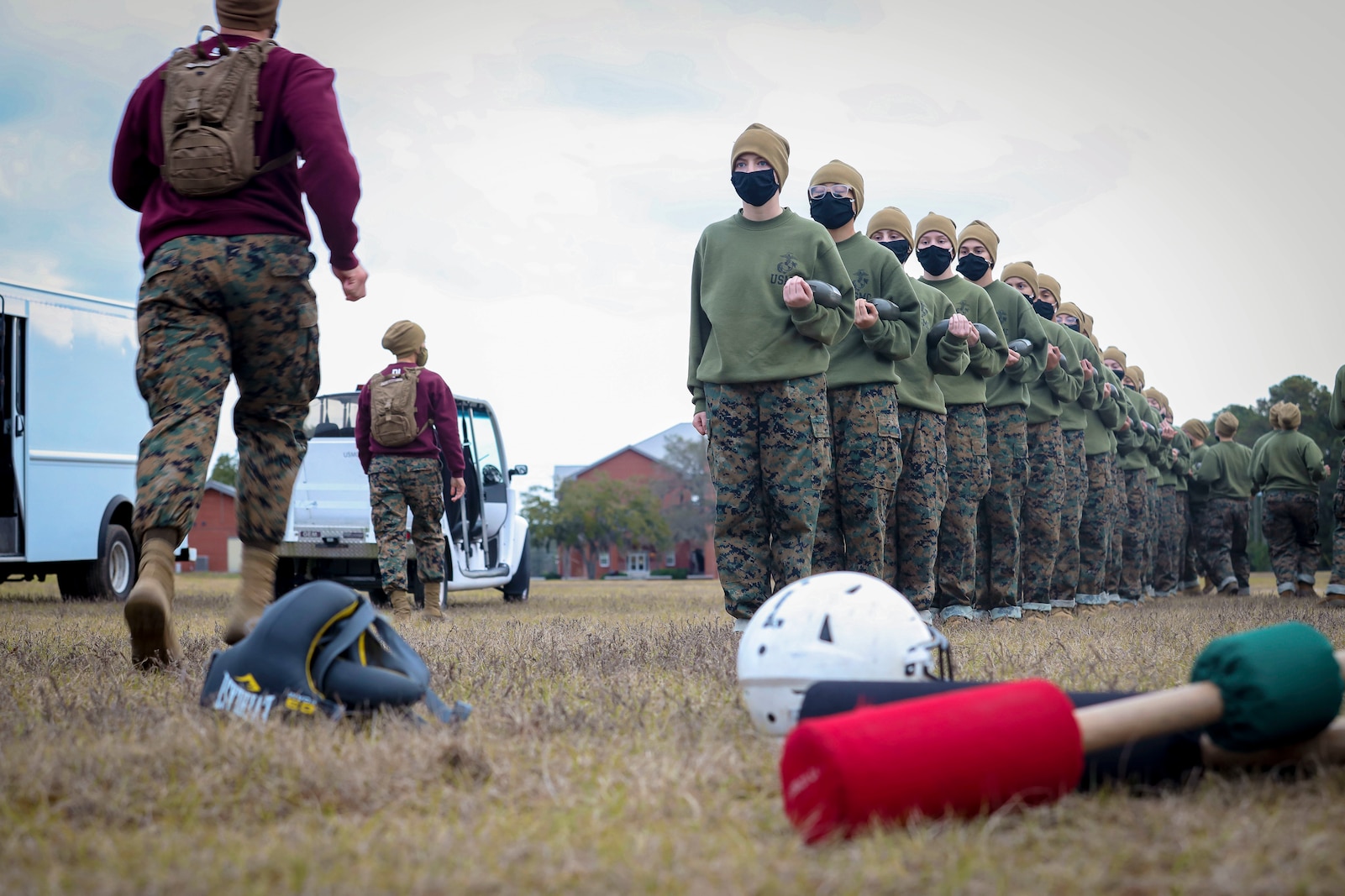 Recruits with Papa Company, 4th Recruit Training Battalion, prepare to conduct pugil sticks bouts aboard Marine Corps Recruit Depot Parris Island, S.C. Jan. 11, 2021. Pugil sticks help recruits practice the fundamentals of Marine Corps Martial Arts. (U.S. Marine Corps photo by Cpl. Dylan Walters)