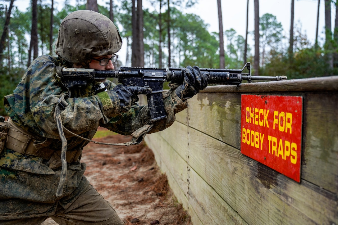 A recruit with Hotel Company, 2nd Recruit Training Battalion posts security while her fellow recruits navigate an obstacle during the Crucible Jan. 15, 2020 at Marine Corps Recruit Depot Parris Island, S.C. The Crucible is recruit training’s 54-hour culminating event that involves food and sleep deprivation and the completion of myriad events for recruits to complete in order to claim the title United States Marine.







(U.S. Marine Corps Photo by Gunnery Sgt. Tyler Hlavac)