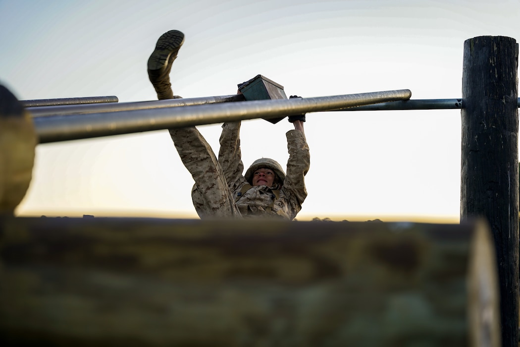 A recruit with Hotel Company, 2nd Recruit Training Battalion attempts to overcome an obstacle on the obstacle course portion of the Crucible Jan. 14, 2020 at Marine Corps Recruit Depot Parris Island, S.C. The Crucible is recruit training’s 54-hour culminating event that involves food and sleep deprivation and the completion of myriad events for recruits to complete in order to claim the title United States Marine.