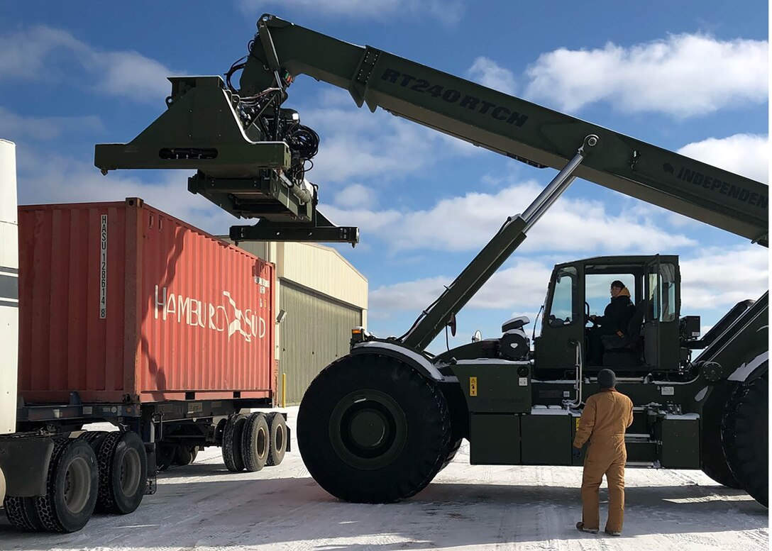 Teresa Cowell operates a rough terrain container handler to move a container that arrived Jan. 27 at the Battle Creek Michigan Air National Guard Base.