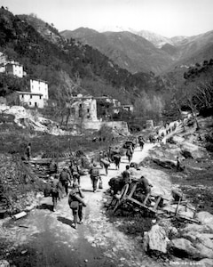 The "Doughfoots” of the 92nd Infantry Division pursue the retreating Germans through the Po Valley in May 1945.