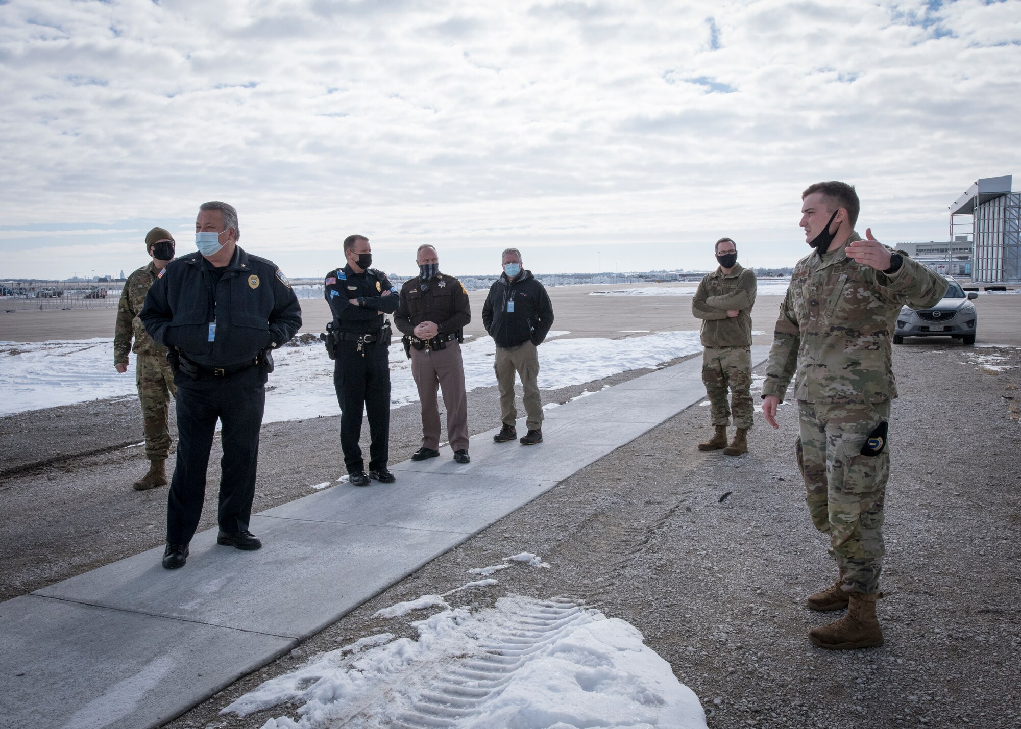 Military members and civilian police tour the flight line at the Lincoln Air Port