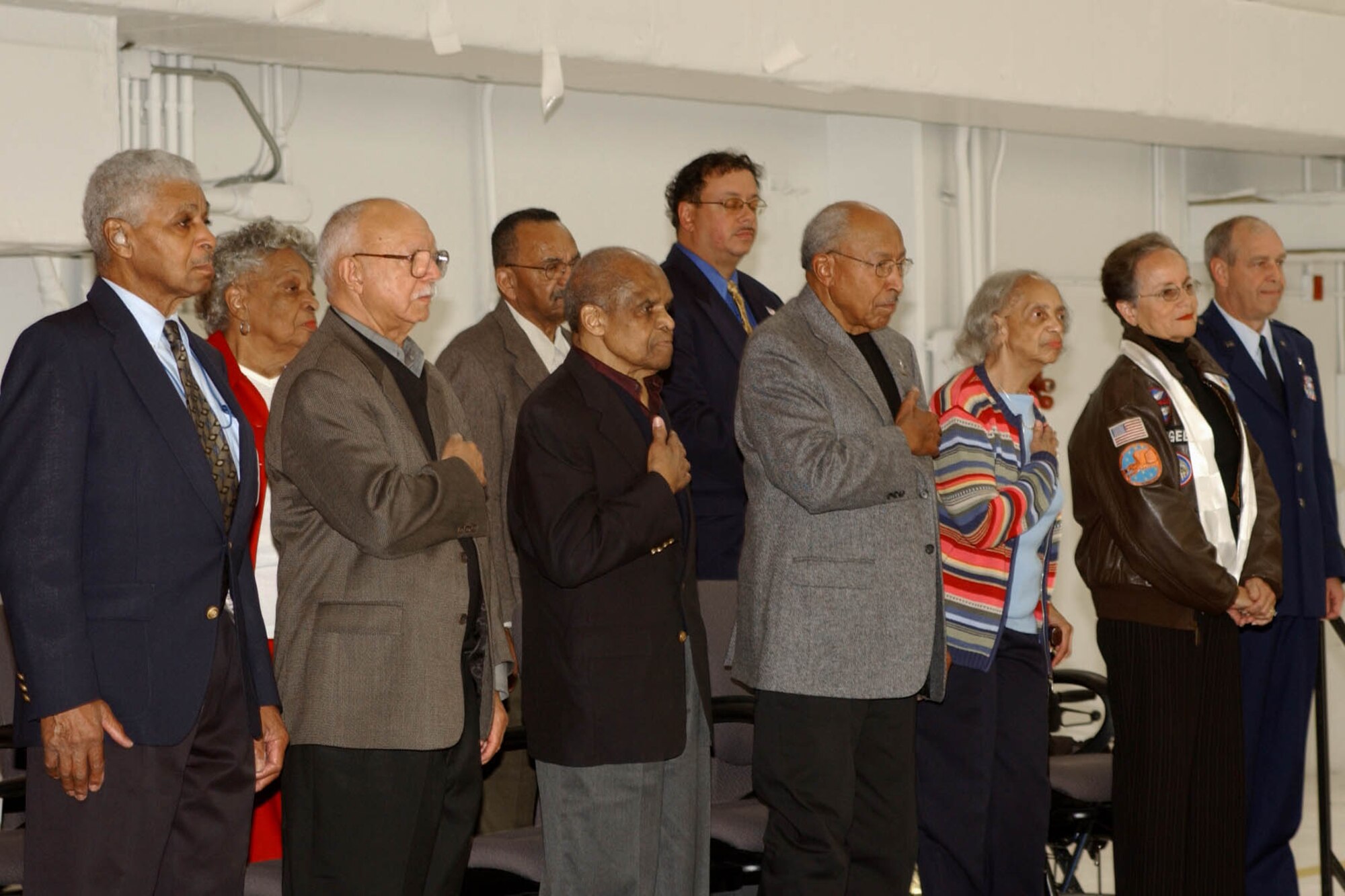 Members of Iowa's Tuskegee Airmen gather to witness the dedication of the 132d Wing's P-51 Mustang "Dutchess Arlene" static display.  (Courtesy photo)