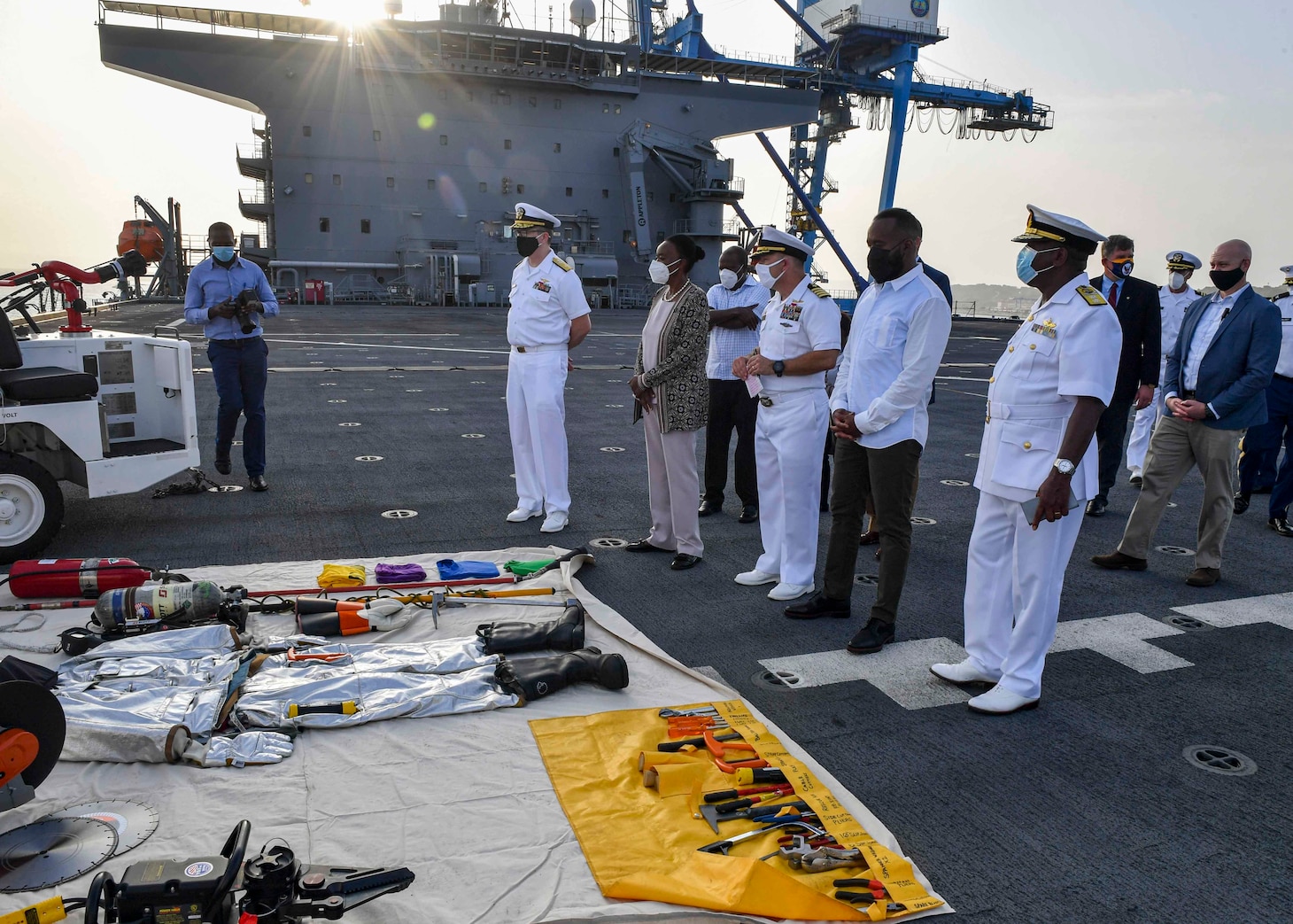 U.S. Service Members and Kenyan officials receive a presentation on flight deck firefighting and the equipment needed to help put out fires while on board the Expeditionary Sea Base USS Hershel "Woody" Williams (ESB 4) in Mombasa, Kenya Feb. 9, 2021.