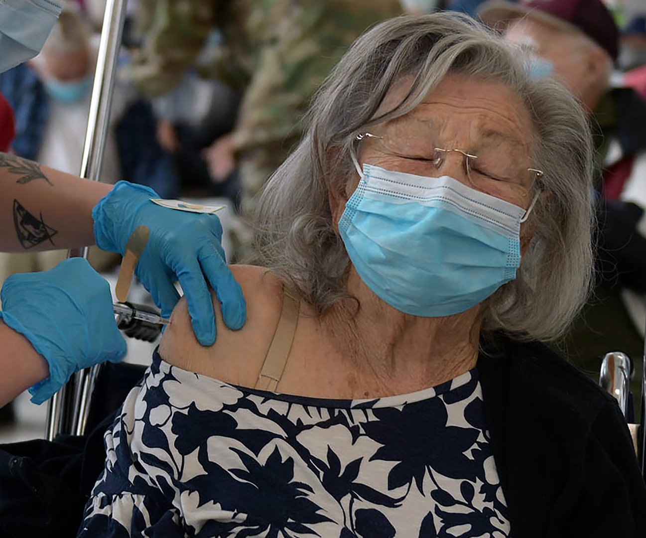 A 59th Medical Wing medic vaccinates the oldest patient thus far – 101 years old -- at Wilford Hall Ambulatory Surgical Center at Joint Base San Antonio-Lackland Feb. 6.