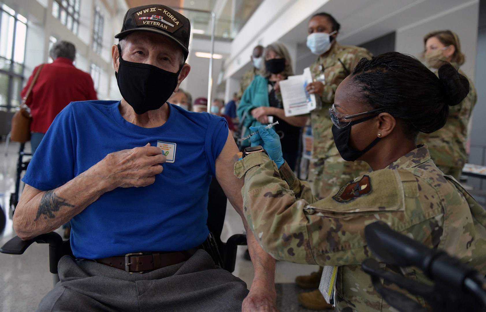 Maj. Carla Cox, 59th Medical Wing commander’s executive officer, vaccinates a San Antonio Military Health System beneficiary Feb. 6 at Wilford Hall Ambulatory Surgical Center at Joint Base San Antonio-Lackland.