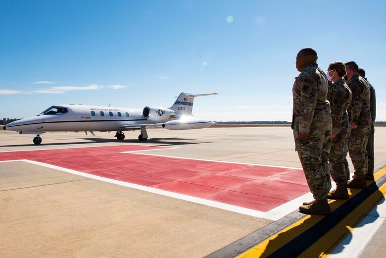 A photo of General Harrigian being greeted by Moody leadership.