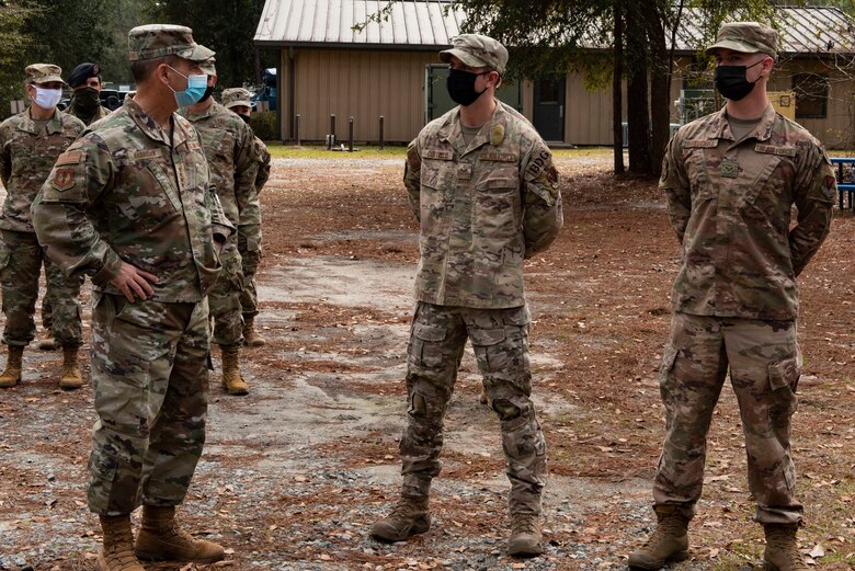 A photo of General Harrigian recognizing Airmen.