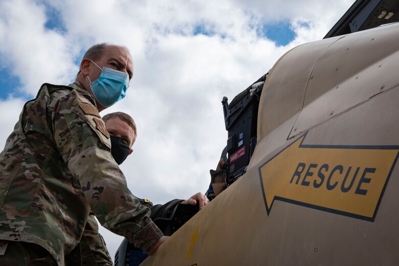 A photo of General Harrigian examining an A-29 Super Tucano.