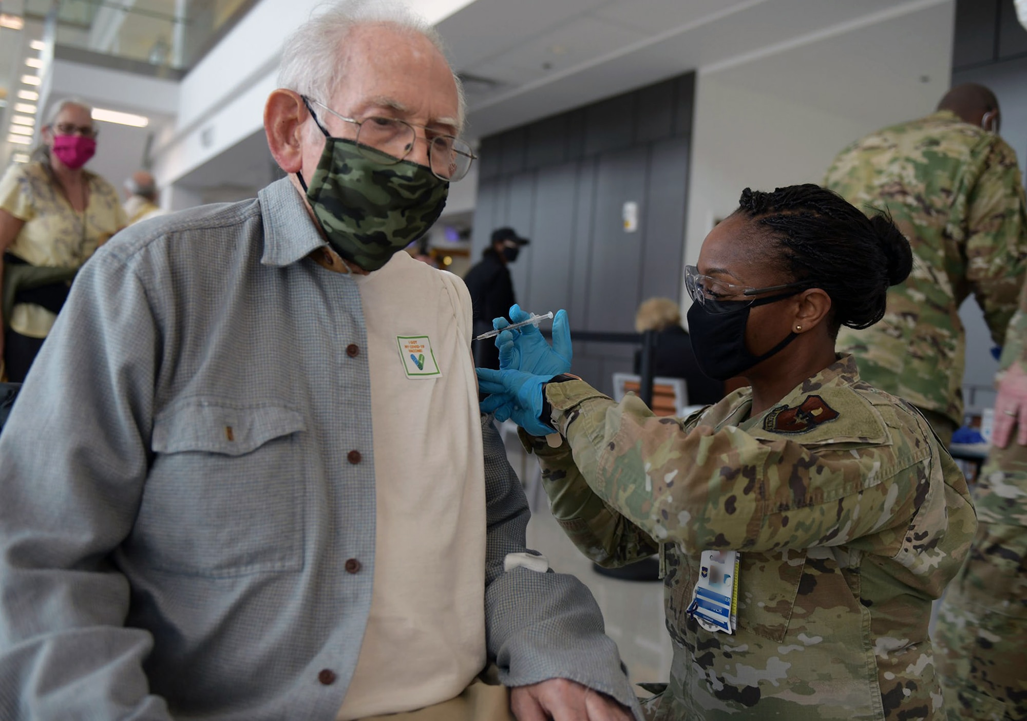 Maj. Carla Cox, 59th Medical Wing commander’s executive officer, vaccinates a San Antonio Military Health System beneficiary Feb. 6 at Wilford Hall Ambulatory Surgical Center at Joint Base San Antonio-Lackland.