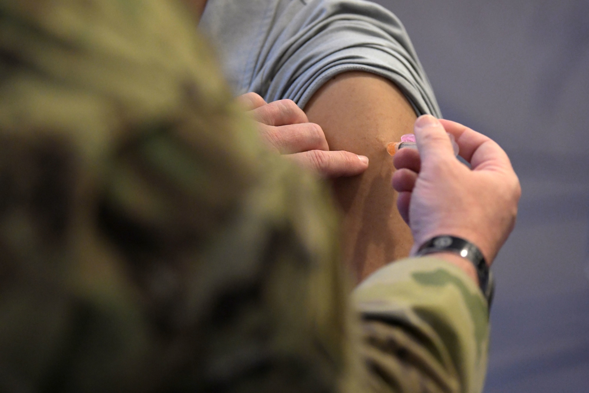 Red Cross volunteers and paramedics administer the Moderna COVID-19 vaccine to Team Kadena’s first-line defenders, Jan. 29, 2021, at Kadena Air Base, Japan. The COVID-19 vaccination plan is phase-driven and designed to safely protect members within the DoD as quickly as possible. (U.S. Air Force photo by Airman 1st Class Rebeckah Medeiros)