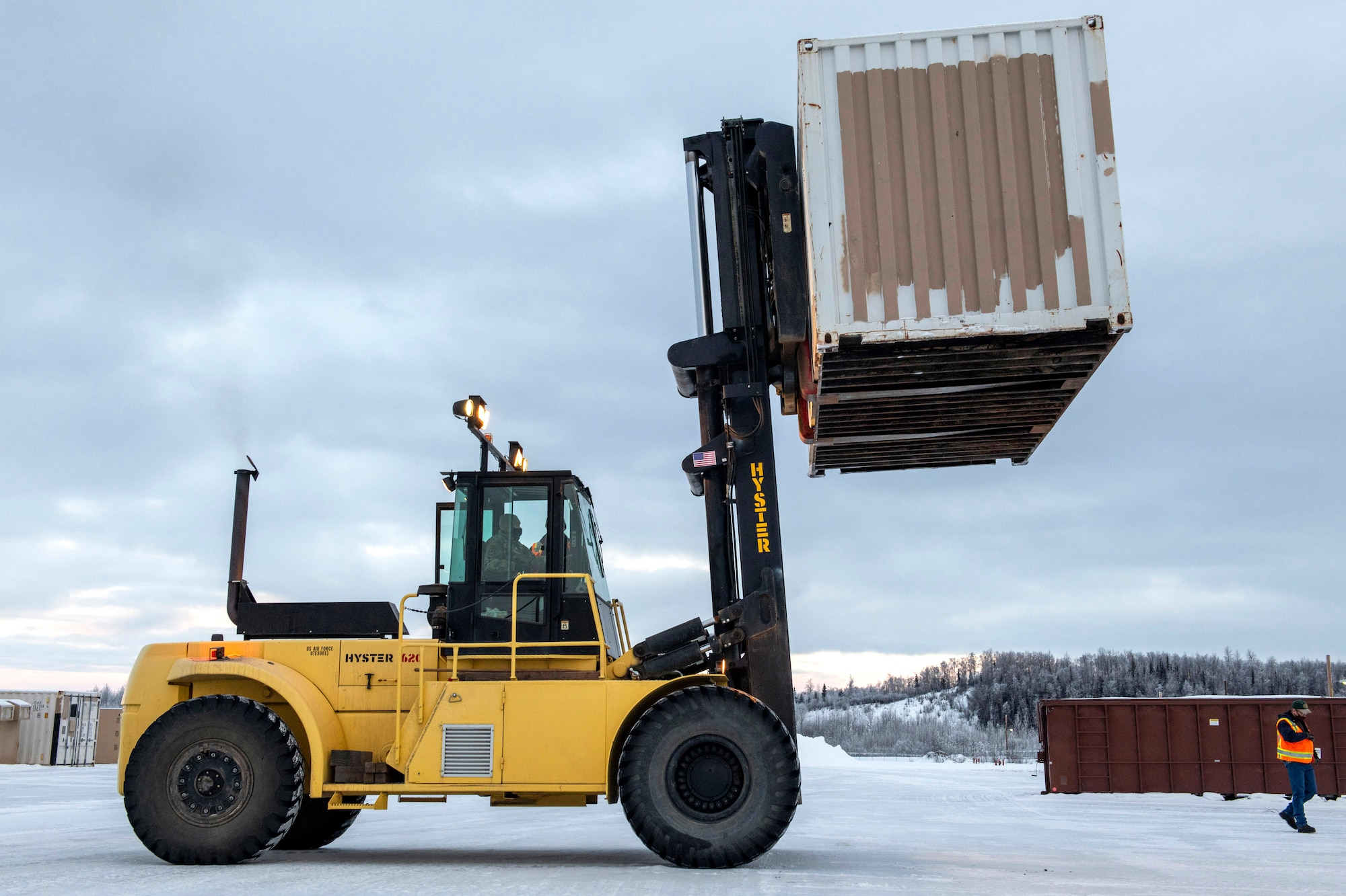 U.S. Air Force Col. Kirsten Aguilar, Joint Base Elmendorf-Richardson and 673d Air Base Wing commander, learns how to operate a forklift during a 773d Logistics Readiness Squadron immersion tour at JBER, Alaska, Jan. 29, 2021. Aguilar familiarized herself with the squadron and its role in supporting the installation’s mission readiness after taking command of the installation July 14, 2020. The 773d LRS provides cargo movement, vehicle operations and aerial port functions to both Airmen and Soldiers across the installation.