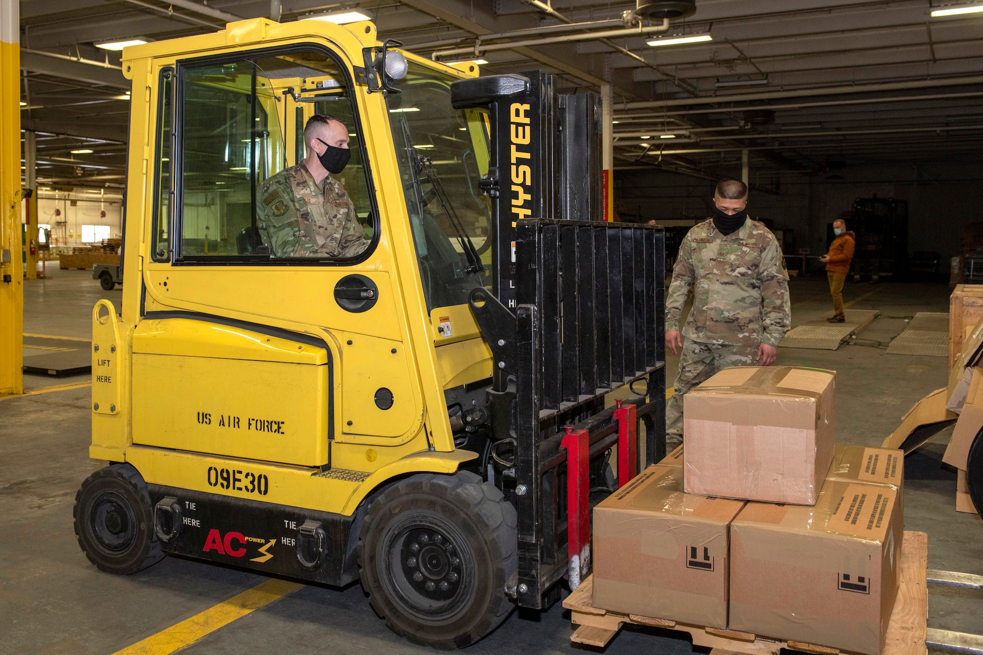 U.S. Air Force Chief Master Sgt. Lee Mills, Joint Base Elmendorf-Richardson and 673d Air Base Wing command chief, learns to operate a forklift during a 773d Logistics Readiness Squadron immersion tour at JBER, Alaska, Jan. 29, 2021. U.S. Air Force Col. Kirsten Aguilar, JBER and 673d Air Base Wing commander, toured the 773d LRS to familiarize herself with the squadron and its role in supporting the installation’s mission readiness after taking command of the installation July 14, 2020. The 773d LRS provides cargo movement, vehicle operations and aerial port functions to both Airmen and Soldiers across the installation.