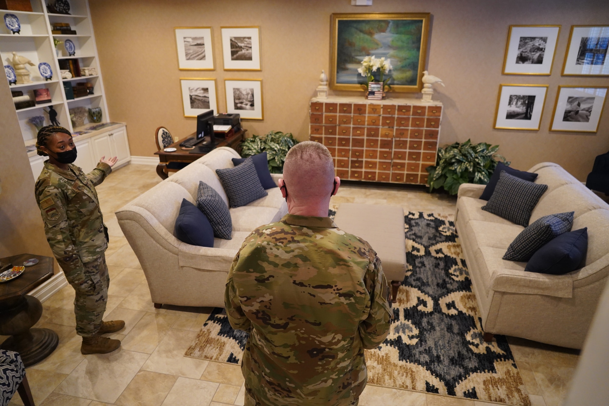 Senior Airman Marlyn Smith, Air Force Mortuary Affairs Operations Fisher House manager on duty, shows the House’s quiet room to Chief Master Sgt. Chad Bickley, 18th Air Force command chief, during an orientation at Dover Air Force Base, Delaware, Feb. 11, 2021. The Center for the Families of the Fallen Fisher House is where AFMAO Airmen offer care, service and support to families of the Fallen. (U.S. Air Force photo by Staff Sgt. Benjamin N. Valmoja)