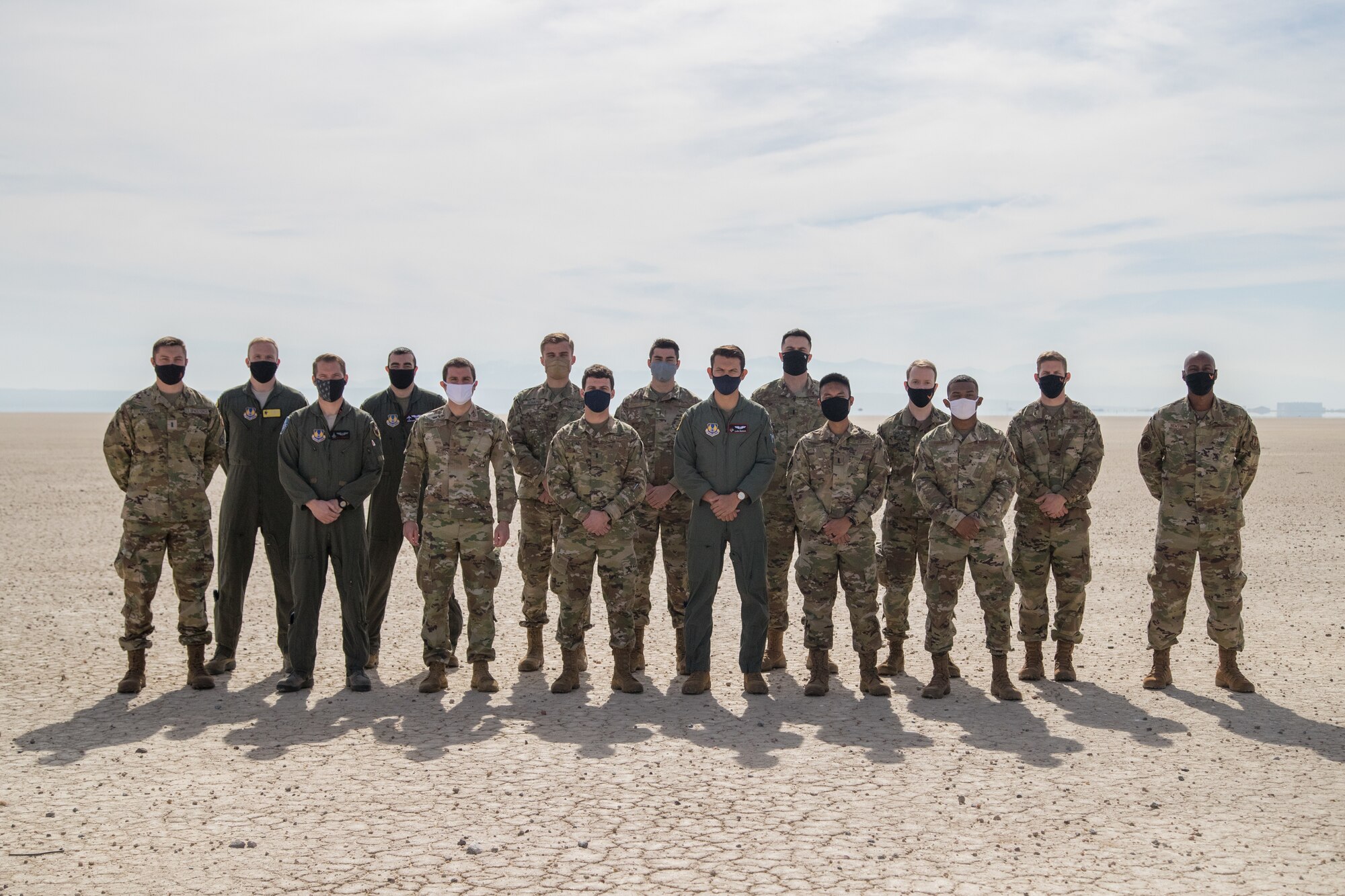 Airmen from Edwards Air Force Base, California, pose for a group photo on the Rogers Dry Lake Bed prior to their U.S. Space Force transfer ceremony, Feb. 11. (Air Force photo by Richard Gonzales)