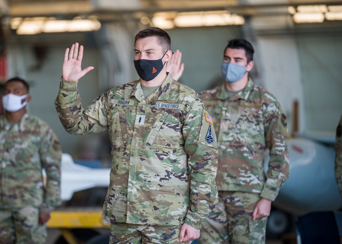 1st Lt. Jared Bogdan recites the oath of office during a Space Force Transfer Ceremony at Edwards Air Force Base, California, Feb. 11. (Air Force photo by Giancarlo Casem)