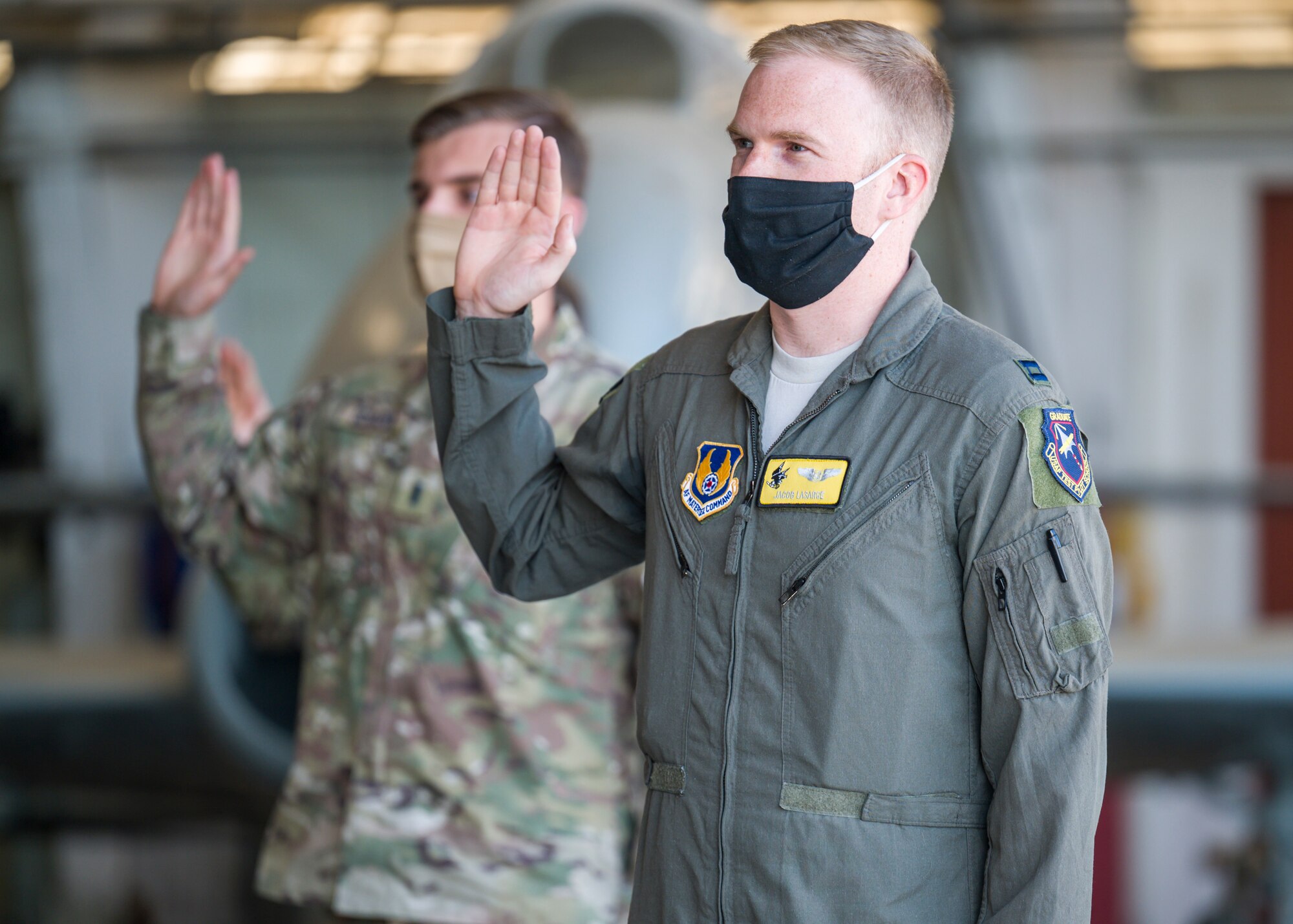 Capt. Jacob LaSarge, 452nd Flight Test Squadron, originally of Byron Center, Michigan, recites the oath of office during a Space Force Transfer Ceremony at Edwards Air Force Base, California, Feb. 11. (Air Force photo by Giancarlo Casem)