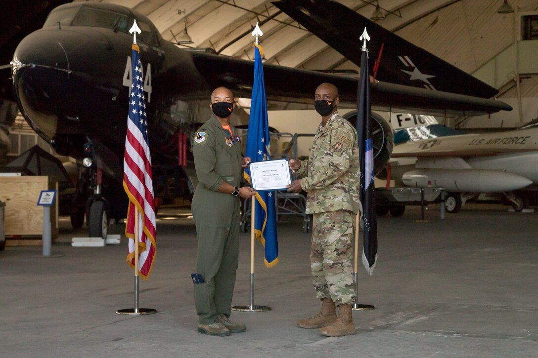 Master Sgt. Sheldon Newton, 412th Communications Squadron, originally of Watha, North Carolina, accepts his U.S. Space Force certificate from Col. Randel Gordon, 412th Test Wing Vice Commander, during a Space Force Transfer Ceremony at Edwards Air Force Base, California, Feb. 11. (Air Force photo by Richard Gonzales)