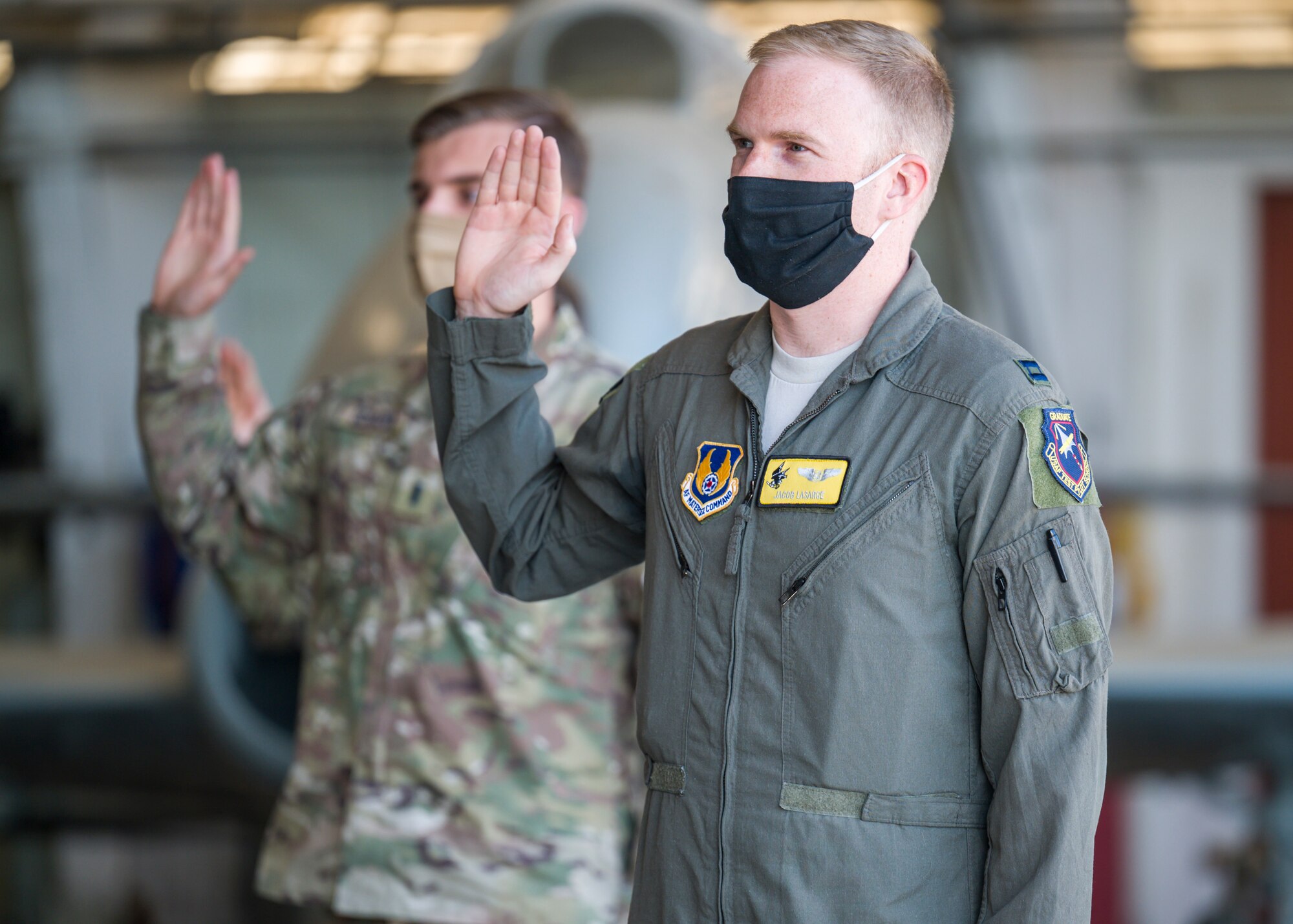 Capt. Jacob LaSarge, 452nd Flight Test Squadron, originally of Byron Center, Michigan, recites the oath of office during a Space Force Transfer Ceremony at Edwards Air Force Base, California, Feb. 11. (Air Force photo by Giancarlo Casem)
