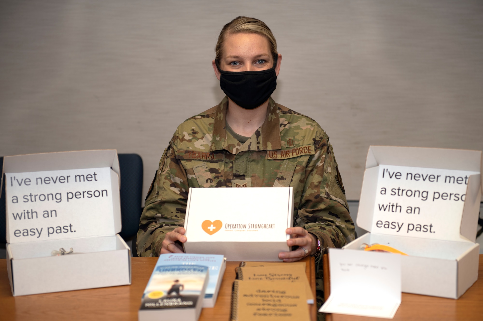 Tech. Sgt. Janna L. Ybarra, readiness noncommissioned officer, Airman and Family Readiness Center at Edwards Air Force Base, displays the contents of an Operation Strongheart kit, Jan. 28.