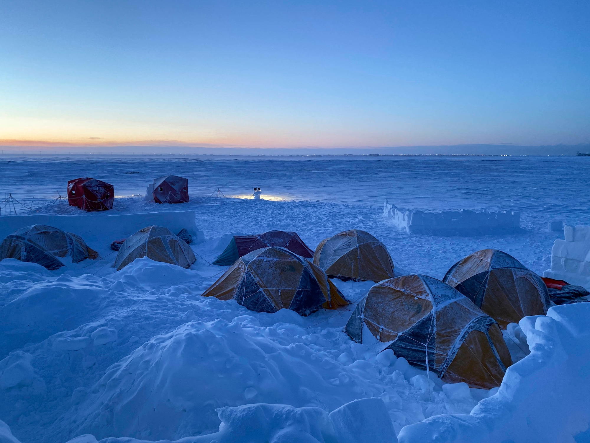 Survival, evasion, resistance and escape (SERE) specialists going through upgrade training stay over in tents at Utqiaġvik (Barrow), Alaska, Jan. 13, 2021.