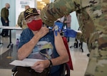 A 59th Medical Wing medic vaccinates a San Antonio Military Health System beneficiary Feb. 6 at Wilford Hall Ambulatory Surgical Center at Joint Base San Antonio-Lackland.