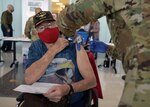 A 59th Medical Wing medic vaccinates a San Antonio Military Health System beneficiary Feb. 6 at Wilford Hall Ambulatory Surgical Center at Joint Base San Antonio-Lackland.