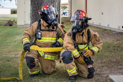 Firefighters from the 902nd Civil Engineer Squadron participate in a demonstration during fire prevention week open house Oct. 12, 2019, at Joint Base San Antonio, Texas.
