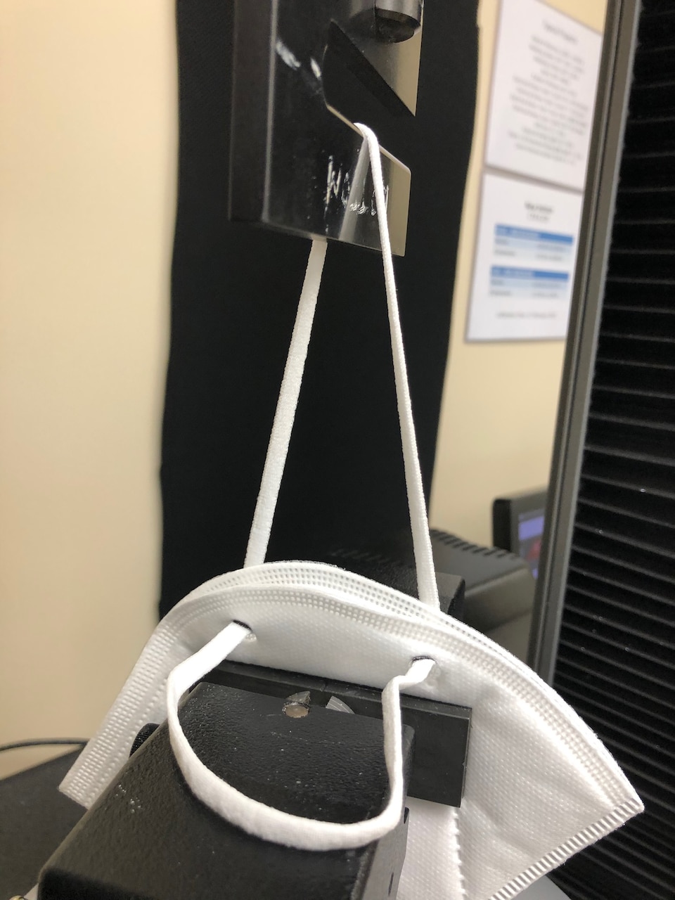 A KN95 mask is tested for durability.