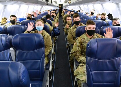 U.S. Army Medical Center of Excellence Advanced Individual Training Soldiers wave once aboard a contract airplane at Joint Base San Antonio-Kelly Field Annex that will take them to their first duty assignment.