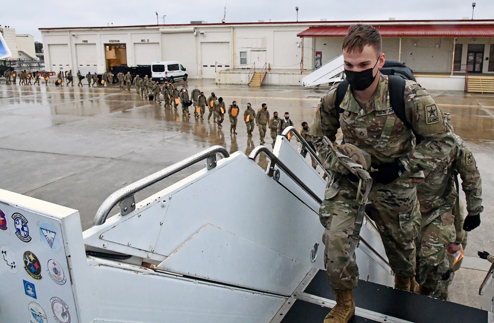 U.S. Army Medical Center of Excellence Advanced Individual Training Soldiers board a contract airplane at Joint Base San Antonio-Kelly Field Annex that will take them to their first duty assignment.