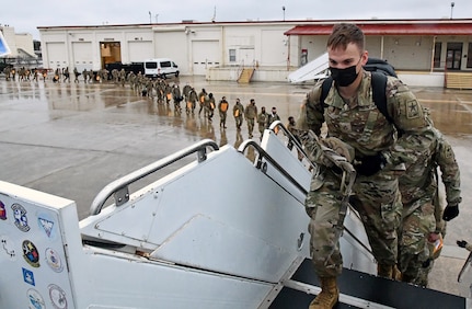 U.S. Army Medical Center of Excellence Advanced Individual Training Soldiers board a contract airplane at Joint Base San Antonio-Kelly Field Annex that will take them to their first duty assignment.