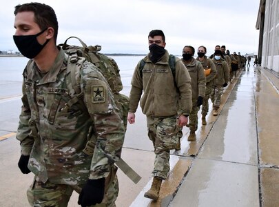 U.S. Army Medical Center of Excellence Advanced Individual Training Soldiers walk in formation at Joint Base San Antonio-Kelly Field Annex before boarding a contract airplane that will take them to their first duty assignment.