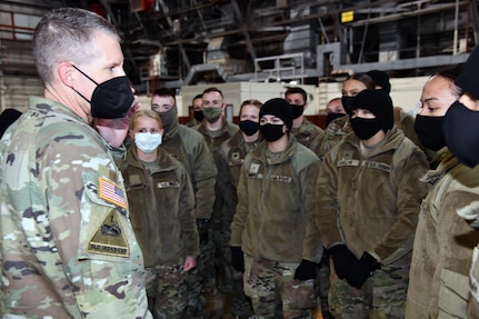 U.S. Army Medical Center of Excellence Command Sgt. Maj. Clark Charpentier speaks to Advanced Individual Training Soldiers departing Joint Base San Antonio to their first assignment.