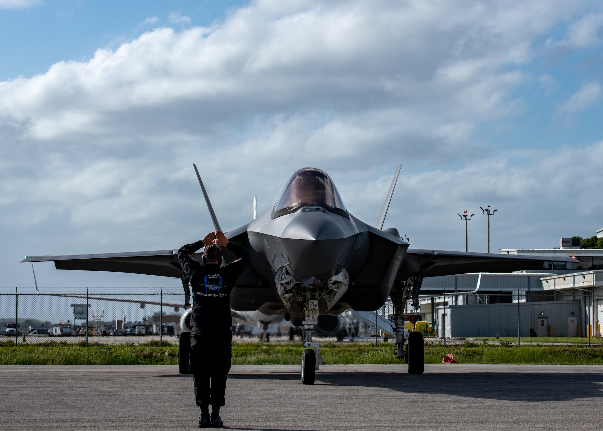 An Air Force maintainer stands in front of an F-35A Lightning II