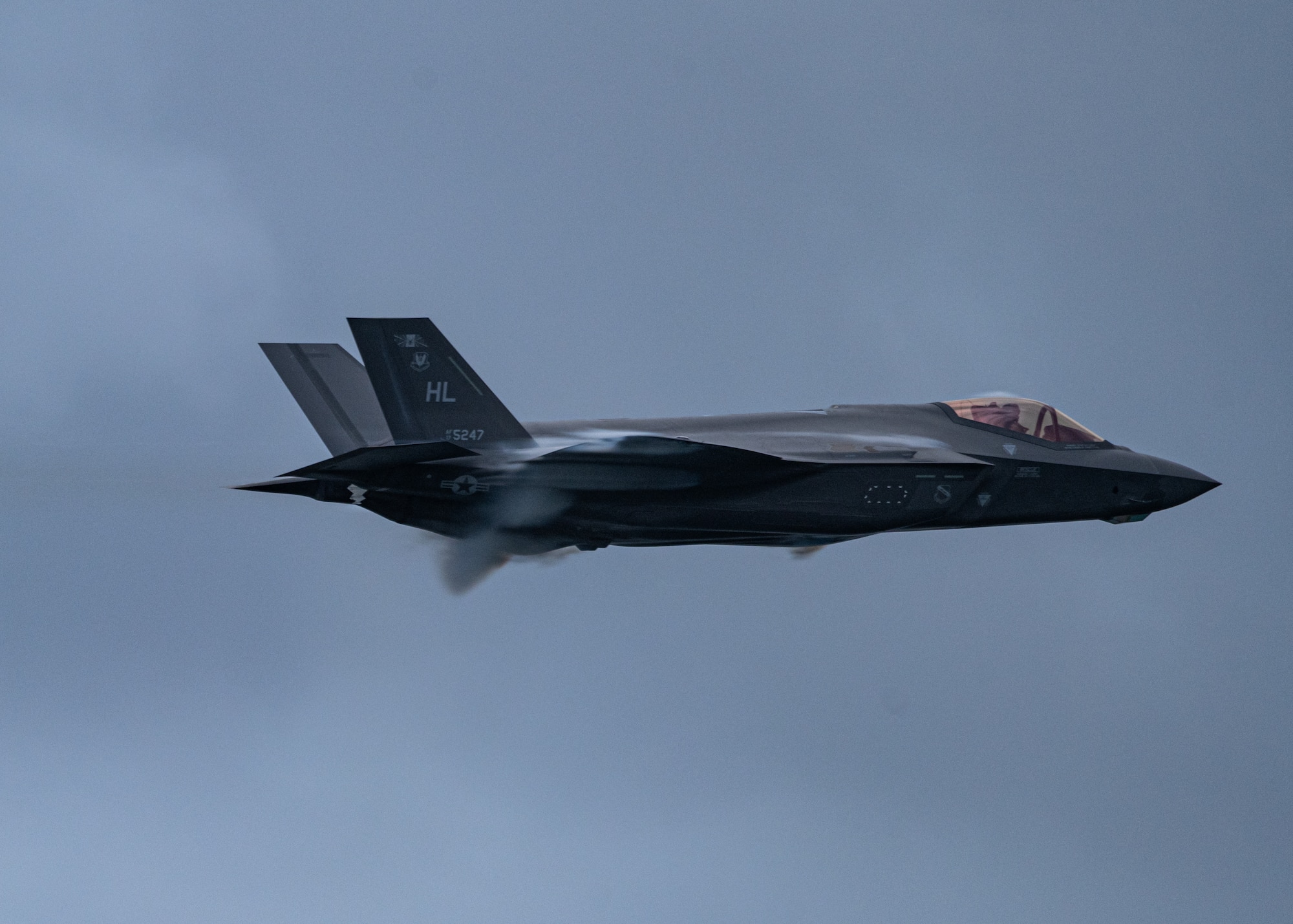 An F-35 flies through the sky