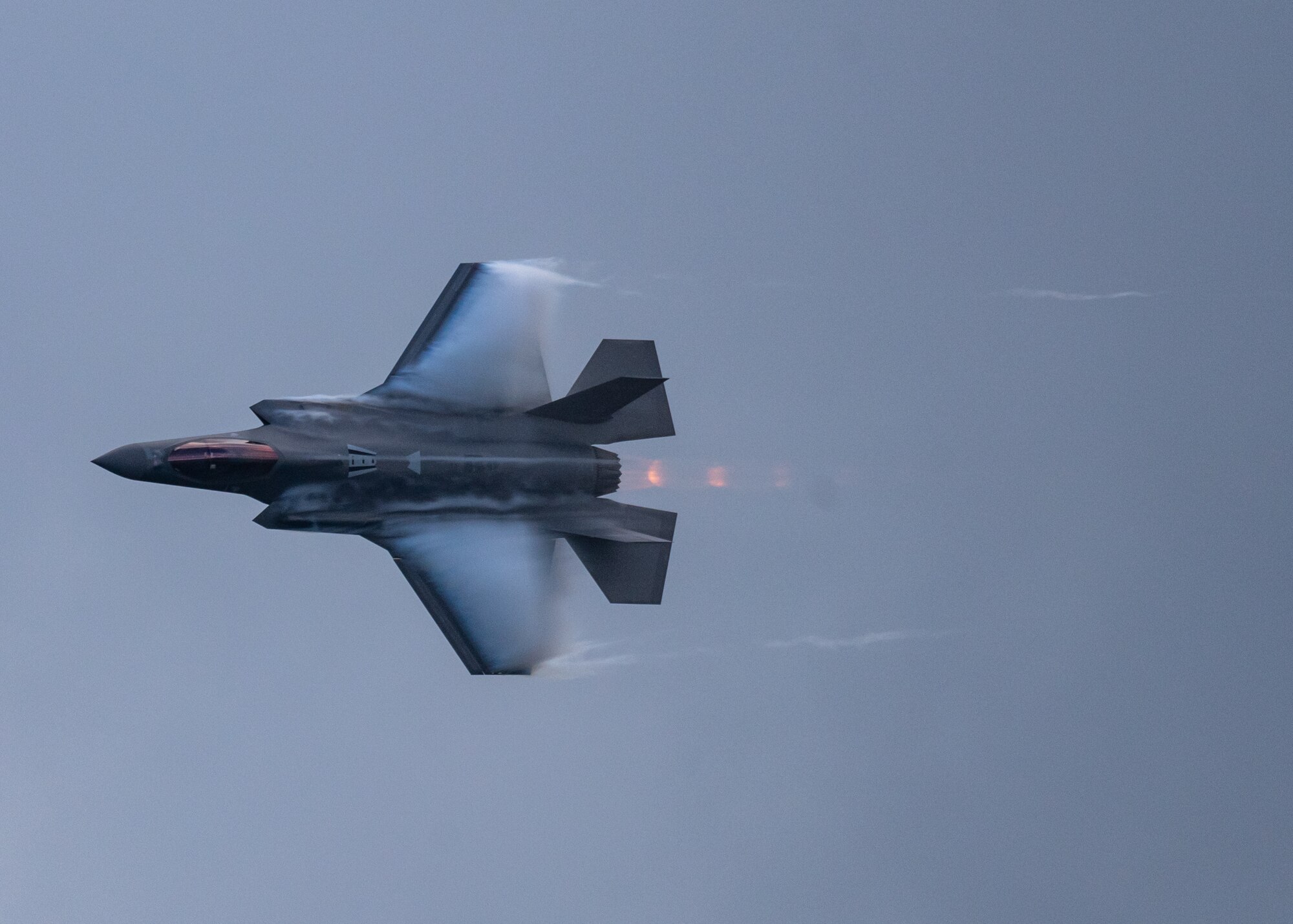 An F-35 from the F-35 Demonstration Team flies through the sky.