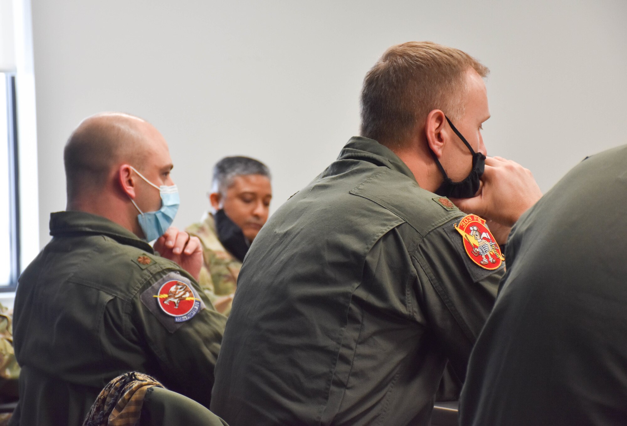 A group of US Air Force captains and majors listen to a presentation during the 3-day Officer Development Course.