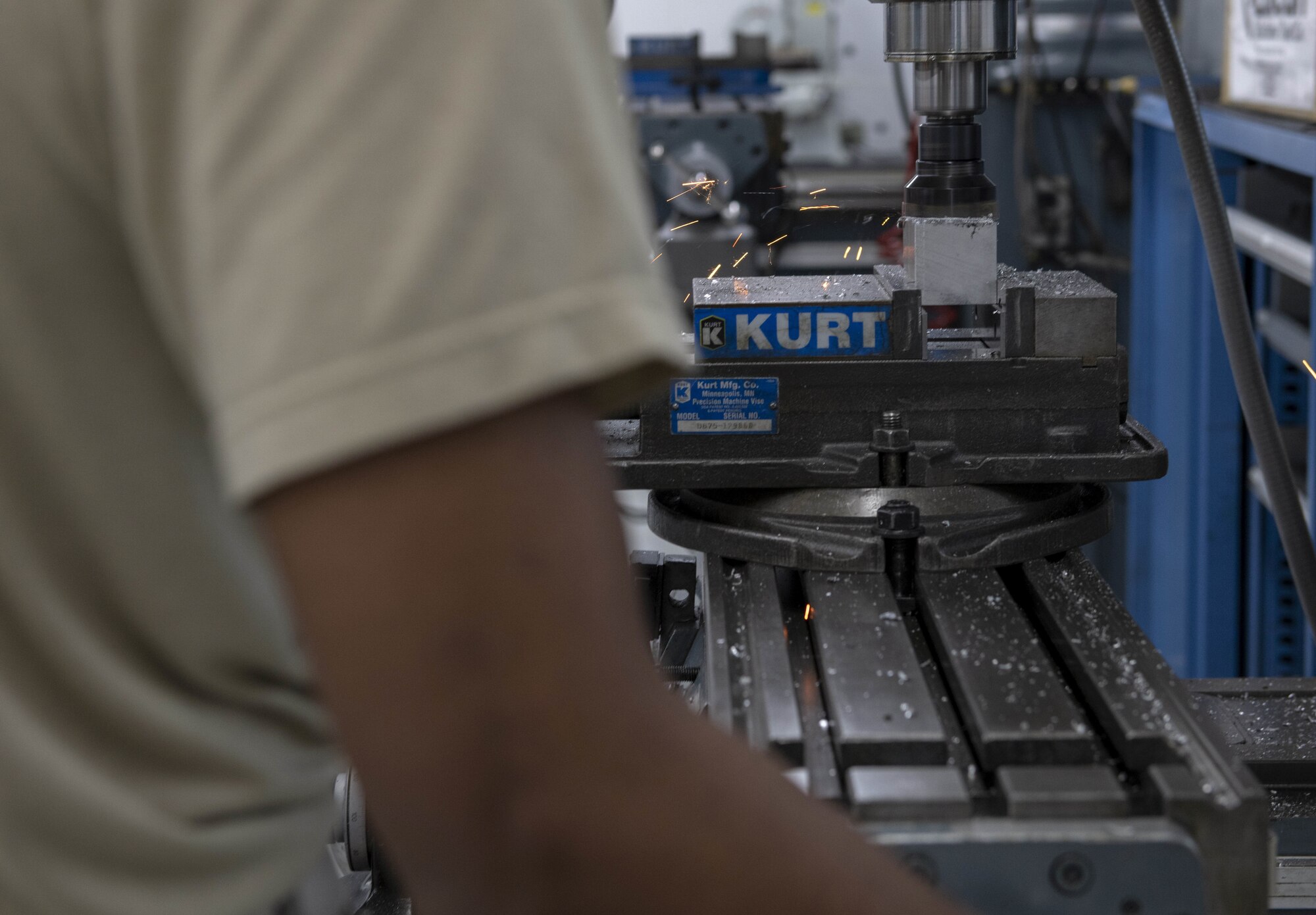 Photo of Airman working with metal.