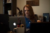 Stacey Benson, community outreach manager for PCSgrades, reviews her work at her home in Charleston, S.C. Feb. 1, 2021.