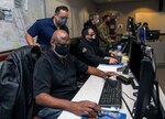 Members of the Joint Base San Antonio Emergency Operations Center perform their duties Feb. 11 at Joint Base San Antonio-Lackland. The EOC has been the command and control hub for emergency operations during the COVID-19 pandemic.