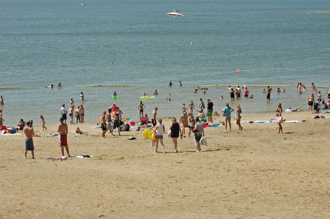 Visitors on sand and in the water at Whitebreast Beach