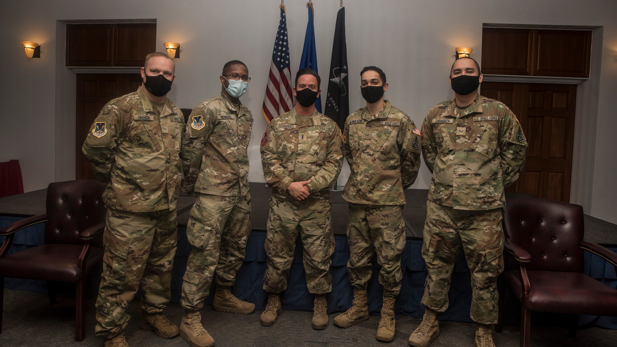 Airmen pose for a photo