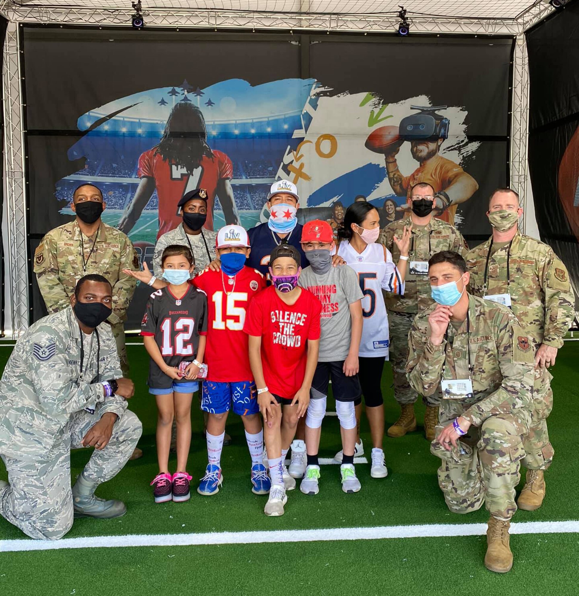 Total Force recruiters posed with a group of fans at the Super Bowl LV Experience outside of Raymond James Stadium in Tampa, Florida, Jan. 31, 2021.