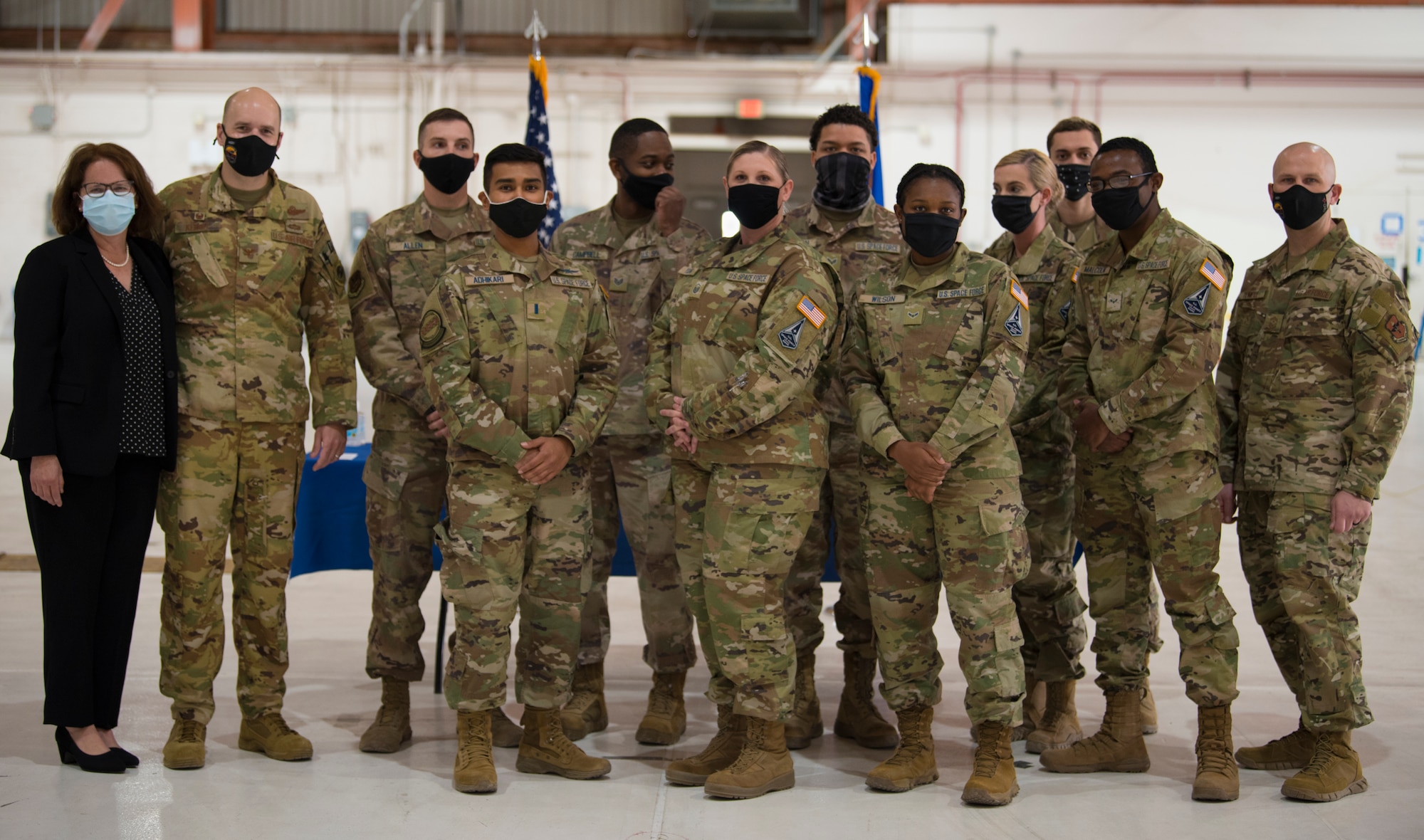The 49th Wing leadership and newly transitioned U.S. Space Force Guardians pose for a photo, Feb. 12, 2021, on Holloman Air Force Base, New Mexico. The Airmen transitioning varied in rank: from Airman 1st Class to 1st Lieutenant. (U.S. Air Force photo by Airman 1st Class Jessica Sanchez)